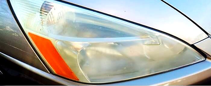 Yellowed, cloudy headlight before restoration.