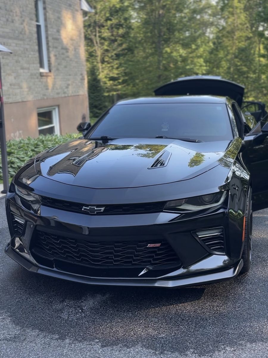 Black Chevrolet Camaro SS with a glossy finish after an exterior detail.