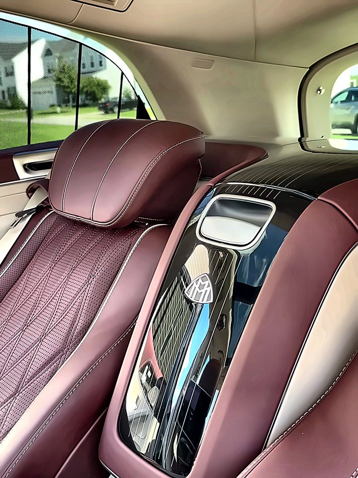 Mercedes-Maybach GLS rear executive seats in burgundy quilted leather after an interior detail.