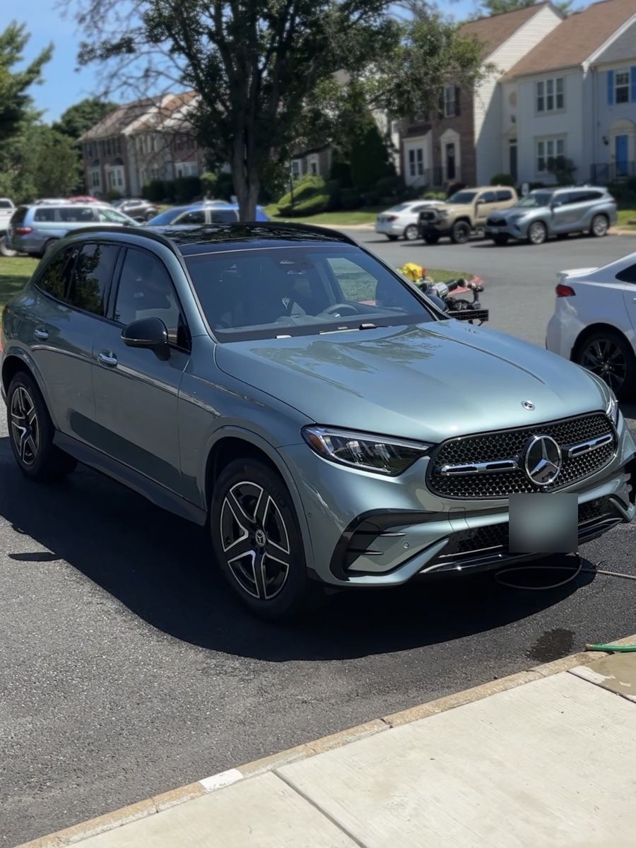 Grey Mercedes-Benz GLC SUV after an exterior detail in a driveway.