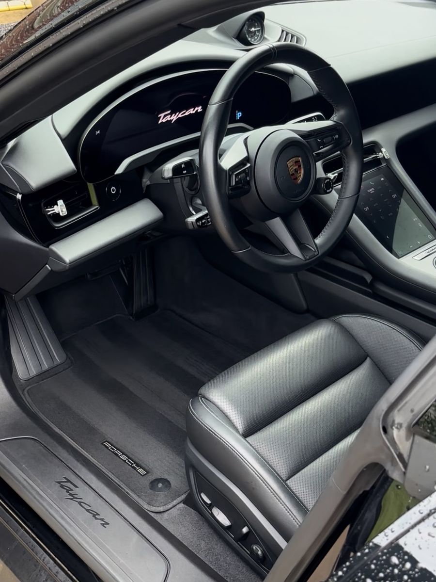 Porsche Taycan cabin, seats and floor mats after an interior detail.